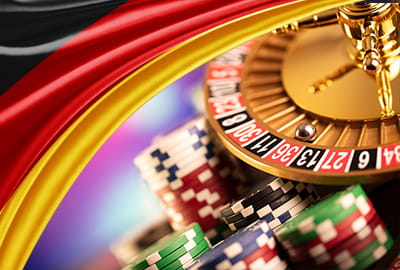 Symboldbild für deutsche Glücksspiel Regelungen, Deutschlandfahne mit Roulette Rad.