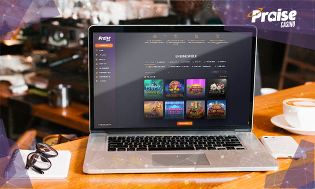 Die Webseite des Praise Casino auf einem Laptop-Bildschirm dargestellt.
